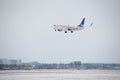 SAS Scandinavian Airlines Boeing 737-800 LN-RRJ landing in Munich Airport, snow Royalty Free Stock Photo