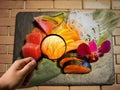 Magnifier on sashimi mix types of fish on stone plate, calories and clean food concept Royalty Free Stock Photo