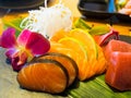 Sashimi mix types of fish on stone plate in Japanese restaurant, fusion and modern Japanese food concept Royalty Free Stock Photo