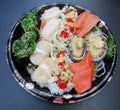 Sashimi, nigiri and sushi combo on takeout plate. Royalty Free Stock Photo