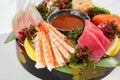 Sashimi set from raw seafood: salmon, tuna, eel, perch, shrimps, sea scallop. Traditional japanesse dish - sashimi on white