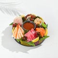 Sashimi set from raw seafood: salmon, tuna, eel, perch, shrimps, sea scallop. Traditional japanesse dish - sashimi on white Royalty Free Stock Photo