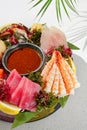 Sashimi set from raw seafood: salmon, tuna, eel, perch, shrimps, sea scallop. Traditional japanesse dish - sashimi on white Royalty Free Stock Photo