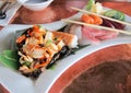 Sashimi, squid salad and vegetables
