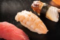 sashimi sushi set on black background, Seafood delicatessen nigiri sushi on a black. Eel, salmon and tuna sushi Royalty Free Stock Photo
