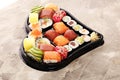 Close up of sashimi sushi set with chopsticks and soy - sushi roll with salmon and sushi roll with smoked eel Royalty Free Stock Photo