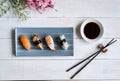 Sashimi sushi set with soy sauce on white wooden table Royalty Free Stock Photo