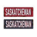 Saskatchewan, Canada rustet metal road sign on a white background