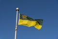 Saskatchewan flag against blue sky