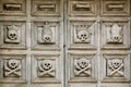 Sassi di Matera. The old door to the church is decorated with crossbone skulls