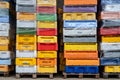 Sassnitz, Germany, August 20, 2020: Stacks of colorful plastic boxes delivered from fishermen of different countries to the fish