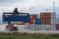 Sassnitz-Mukran, Germany, August 20, 2020: Shunting vehicle is moving a heavy container in the industrial cargo port of Sassnitz