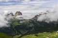 Sassolungo peaks among the clouds. Dolomites. Italy. Royalty Free Stock Photo
