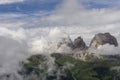 Sassolungo peaks among the clouds. Dolomites. Italy. Royalty Free Stock Photo
