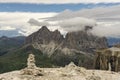 Sassolungo peaks among the clouds. Dolomites. Italy. Royalty Free Stock Photo