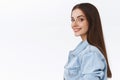 Sassy good-looking happy smiling caucasian woman in denim jacket standing in profile over white background, turn camera