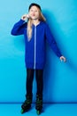 Sassy and sporty. Full-length shot of a young girl wearing a blue hoodie and blowing bubbles. Royalty Free Stock Photo