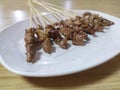 Satay meat on the white plate