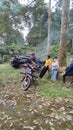 A satay seller with a motorbike is burning satay at the Watu Bahan Tourism Park, Pekalongan, Indonesia 23 November 2022