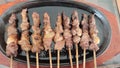 sate kambing or goat meat skewers served on a metal hot plate with peanut sauce in Jakarta, Indonesia Royalty Free Stock Photo
