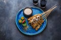 Sate or satay ayam - chicken skewers with peanut sauce, place for wording Royalty Free Stock Photo