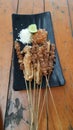 Sate Taichan is a variation of chicken satay grilled. It is served with sambal and squeezed key lime Royalty Free Stock Photo