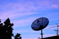 Satelite dish in twilight sky Royalty Free Stock Photo