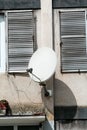 Satellite antenna on the facade building Royalty Free Stock Photo