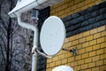 Satellite dish antenna on the house.