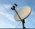 Satellite dish antenna over blue sky background Royalty Free Stock Photo