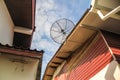 Satellite dish antenna for television on house roof Royalty Free Stock Photo