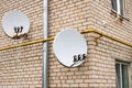 Satellite Dish Dishes On Wall Of Building