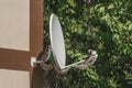 Satellite dish home TV suspended on the wall of the building in the outdoors Royalty Free Stock Photo