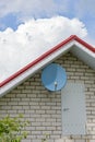Satellite dish on the house wall Royalty Free Stock Photo