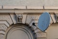 a satellite dish on a house wall Royalty Free Stock Photo