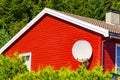 Satellite dish on house wall Royalty Free Stock Photo