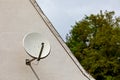 Satellite dish on a house wall Royalty Free Stock Photo