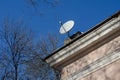 Satellite dish on the roof of the old building Royalty Free Stock Photo