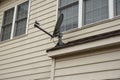 Satellite dish on a roof top Royalty Free Stock Photo