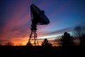 satellite dish silhouette against twilight sky Royalty Free Stock Photo