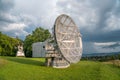 Satellite dish in a summer landscape, radiotelescope for deep space research. Ondrejov observatory, Czech republic. Royalty Free Stock Photo