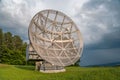 Satellite dish in a summer landscape, radiotelescope for deep space research. Ondrejov observatory, Czech republic. Royalty Free Stock Photo