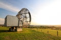 Satellite dish in a summer landscape, sky background. Royalty Free Stock Photo