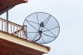 Satellite dish television sky overcast communication technology network on roof of house. Royalty Free Stock Photo