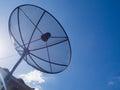 Satellite Dish Transmission Data On Bright Blue Sky Background. Royalty Free Stock Photo