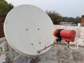 satellite dish and TV antennas on the house roof with blue sky background Royalty Free Stock Photo