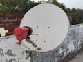 satellite dish and TV antennas on the house roof with blue sky background Royalty Free Stock Photo