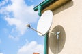 satellite dish and TV antennas on the house roof with blue sky background Royalty Free Stock Photo