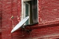 Satellite dish on wall of an old brick house Royalty Free Stock Photo