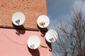Satellite dishes on a brick wall Royalty Free Stock Photo